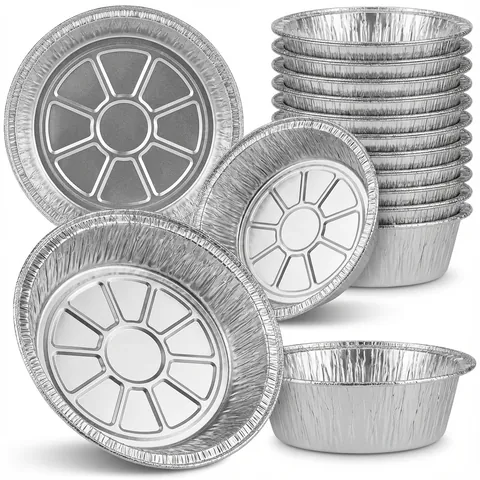 Round silver aluminium foil containers with pleated sides and a pressed pattern in the base, shown loose and in a nested stack, without lids, foil tray, takeaway tray