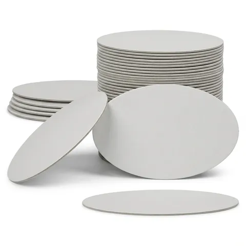 Flat round white board lids for foil containers, shown loose, leaning and in a tall stack, aluminium container, foil tray