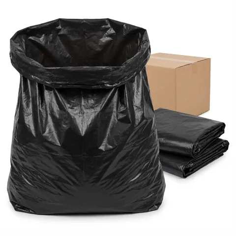 Large black heavy duty bin bag standing open in front of a cardboard case, with folded bags beside it, rubbish bag, refuse sack