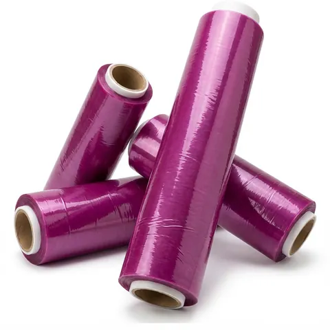 Four rolls of catering cling film on cardboard cores, the film showing a purple tint on the roll, food wrap, clingfilm
