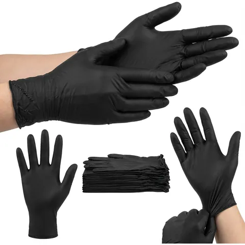 Hands wearing black nitrile gloves, with a single glove, a stack of folded gloves and a glove being pulled on, disposable gloves, black gloves