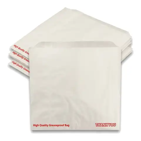 8.5x8.5 White Grease Proof Bag, a pack in front with more packs stacked behind, paper bag, greaseproof bag