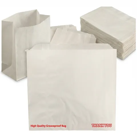 White greaseproof paper bags printed in red with 'High Quality Greaseproof Bag' and 'Thank You', one standing open beside a flat stack, sandwich bag, baguette bag