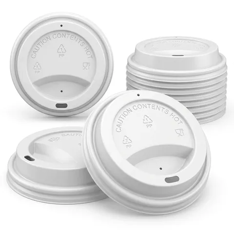White plastic sip lids for 12oz coffee cups embossed 'Caution contents hot', loose and in a stack, paper cup, hot drink cup