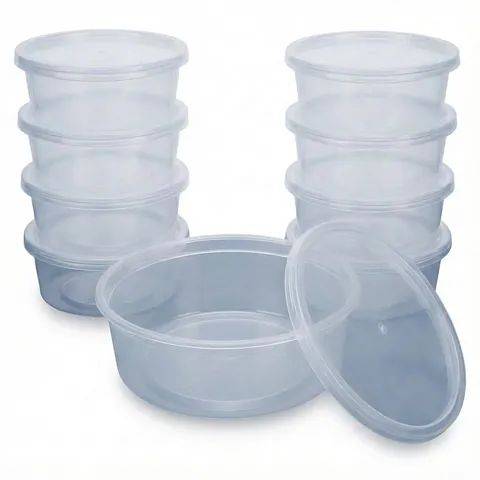 Stacks of clear round plastic containers with push-on lids, with one open container and its lid in front, microwave container, plastic takeaway container