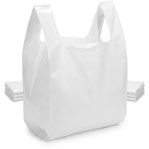 White plastic vest carrier bag standing open, with stacks of folded bags behind it, plastic bag, white carrier bag