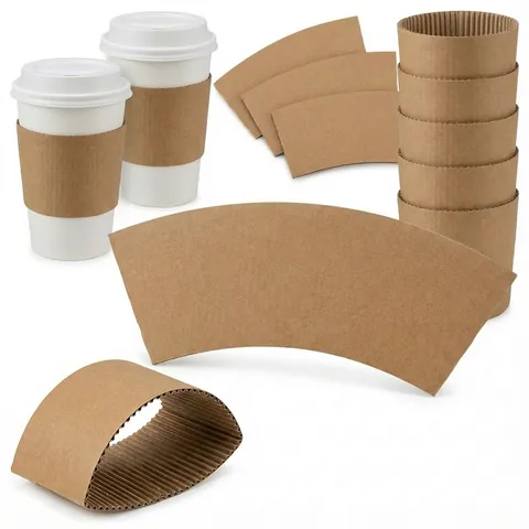 Brown corrugated kraft sleeves on two white takeaway cups, with a stack of sleeves and flat sleeve blanks, paper cup, hot drink cup