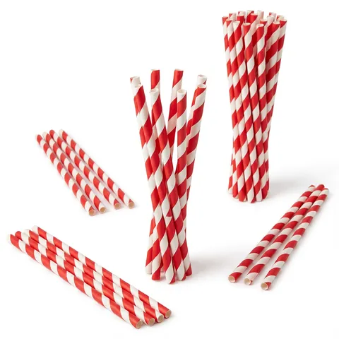 Red and white striped paper straws standing in bundles and lying loose, drinking straw, compostable straw