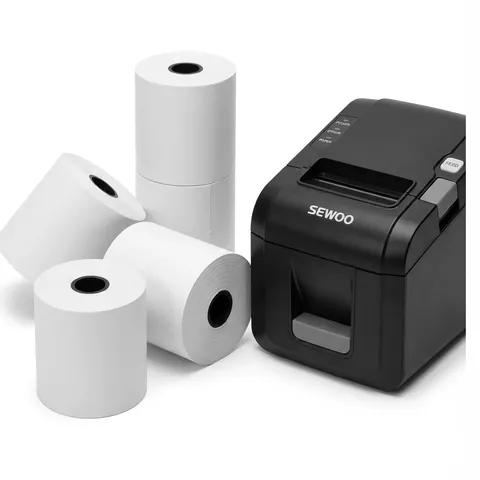 Five white 80 x 80 mm thermal till rolls, two stacked upright, next to a black thermal receipt printer, receipt paper, receipt roll