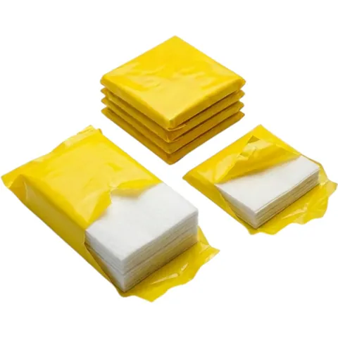 Four yellow film-wrapped packs of white greaseproof paper sheets, two of them opened to show the stacked sheets