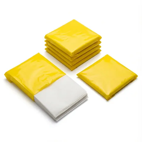 Packs of white greaseproof paper sheets wrapped in yellow film, one pack opened to show the stacked white sheets, wrapping paper, butcher paper
